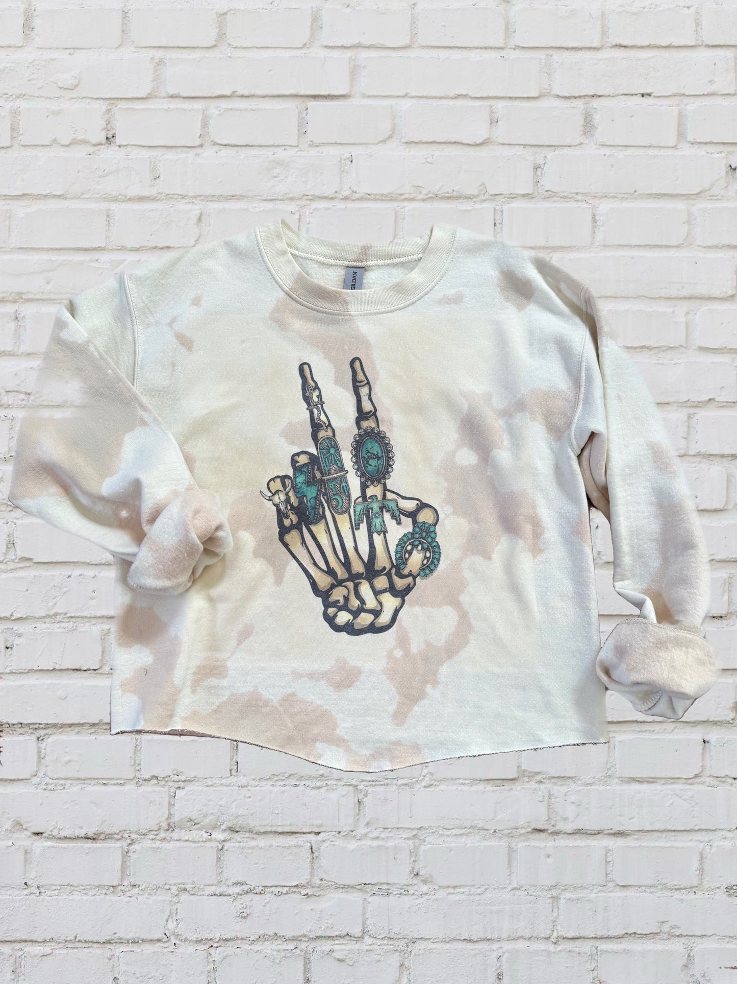 Turquoise Skeleton peace sign tan crewneck