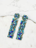 Blue jeweled dangle earrings